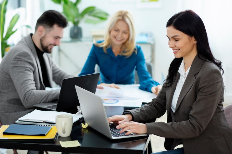 medium-shot-happy-people-working_23-2149300698